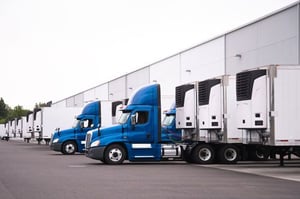 Trucks delivering to a retail distribution center